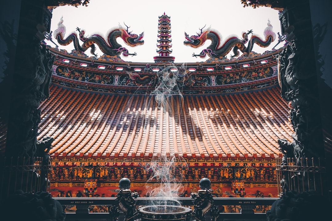 people walking on brown wooden bridge, Yonghe Baofu Temple