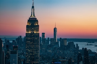 Sunset view of the Atlanta skyline with the iconic Bank of America Plaza glowing against the evening sky.