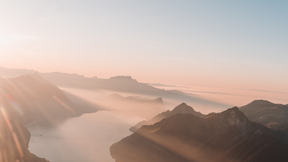 mountains under white clouds during daytime