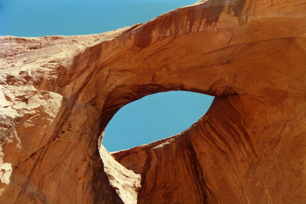 brown rock formation under blue sky during daytime