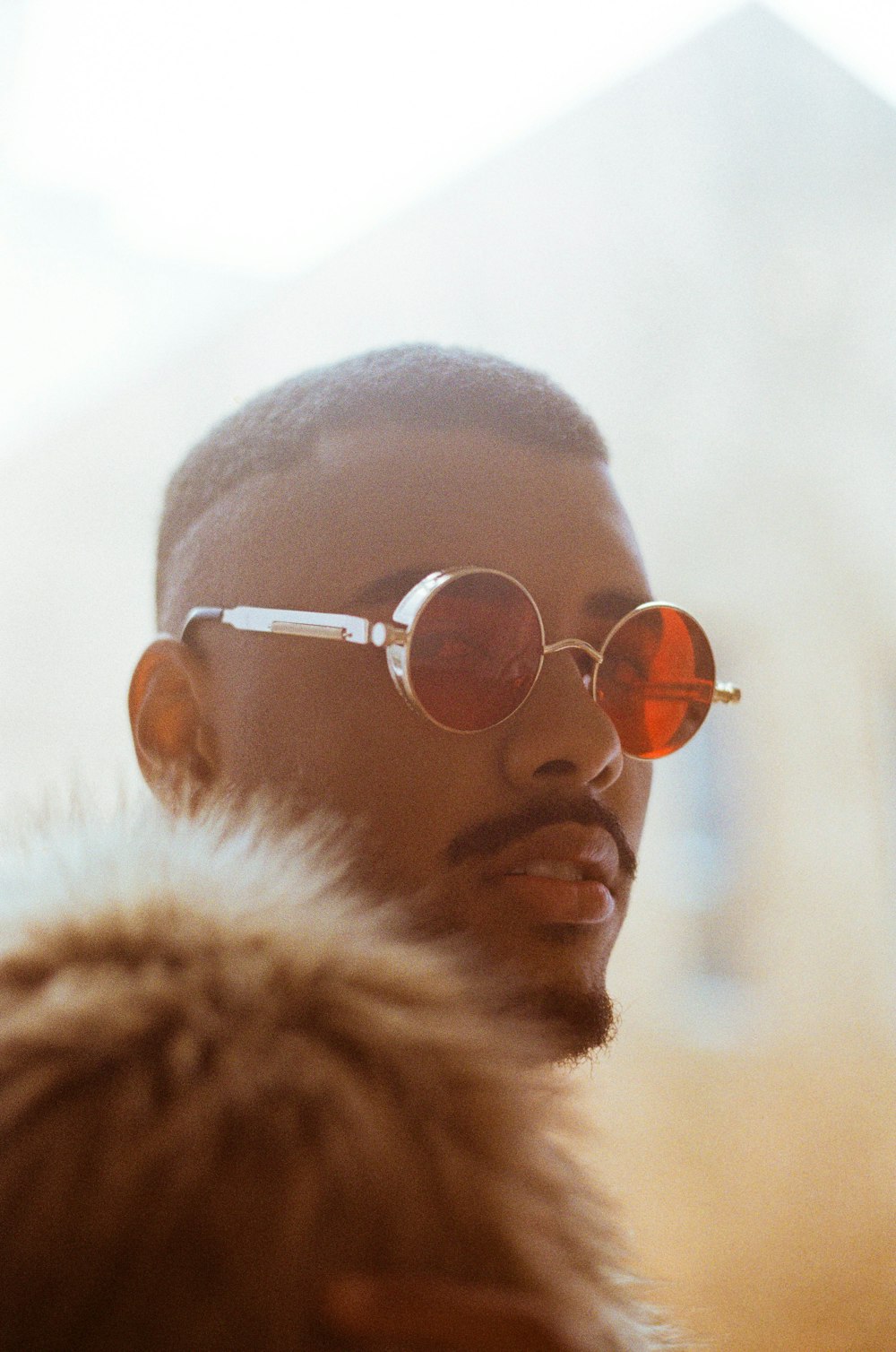 man wearing silver framed aviator style sunglasses