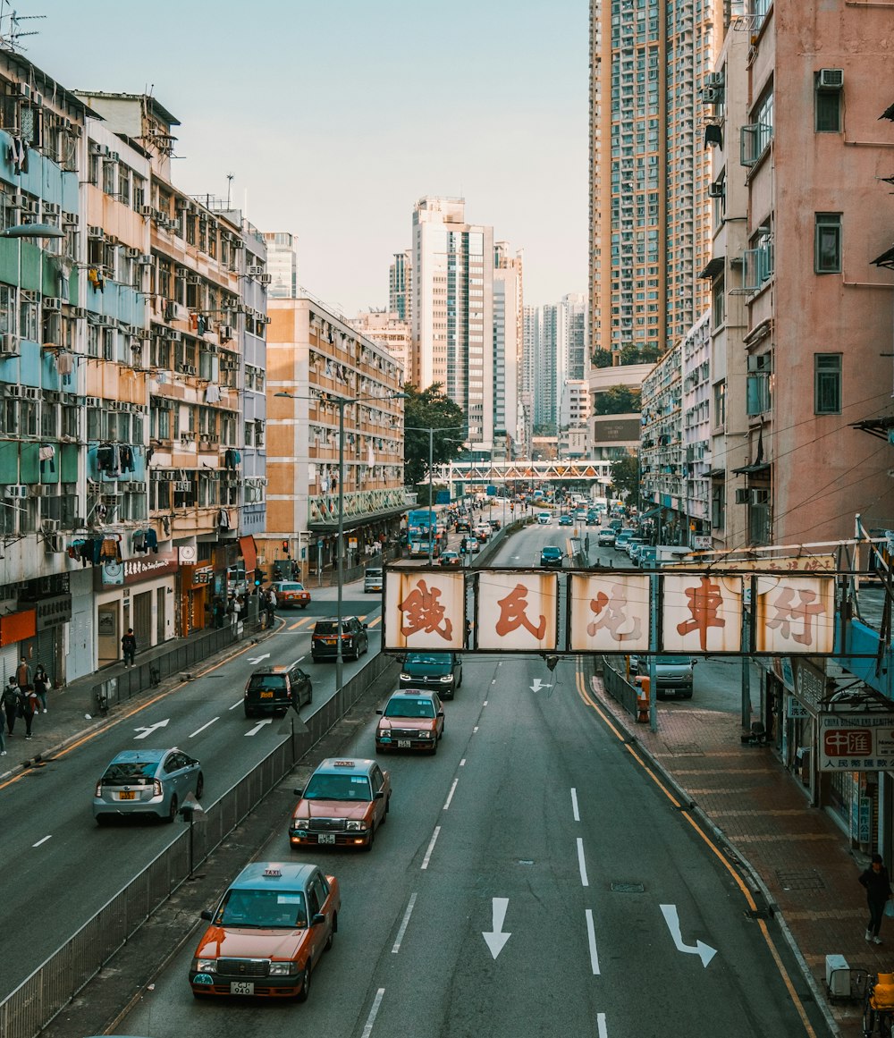 cars on road near buildings during daytime