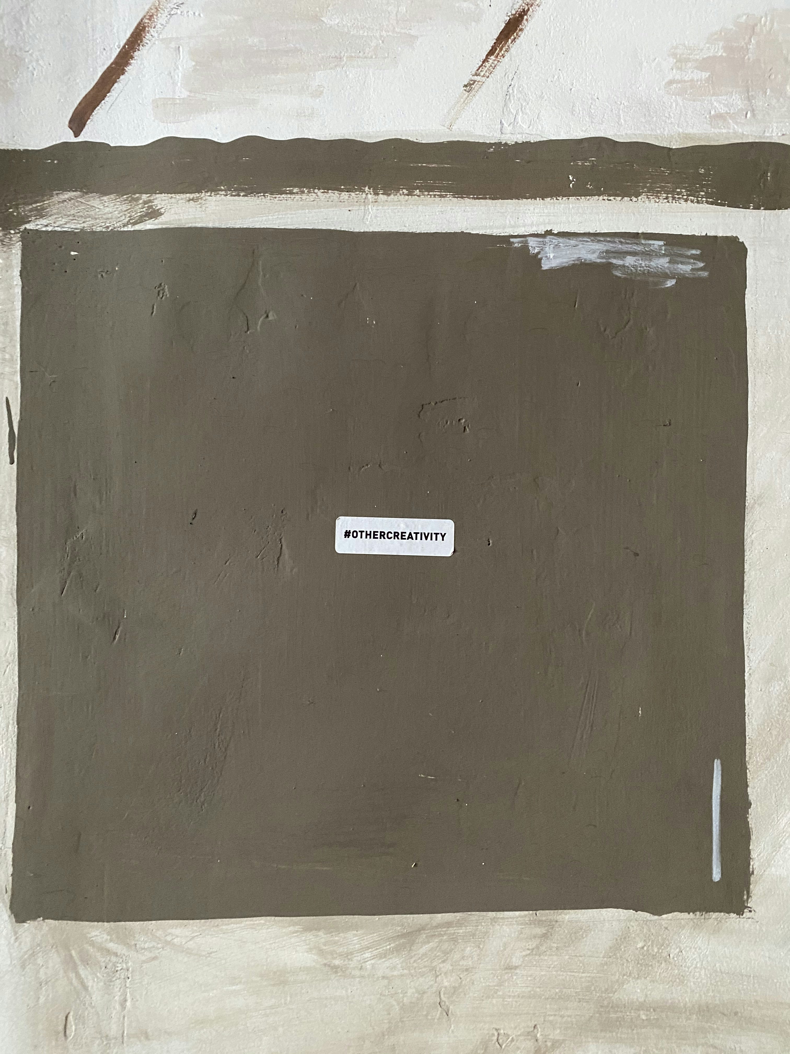 white and black sticker on brown wooden board