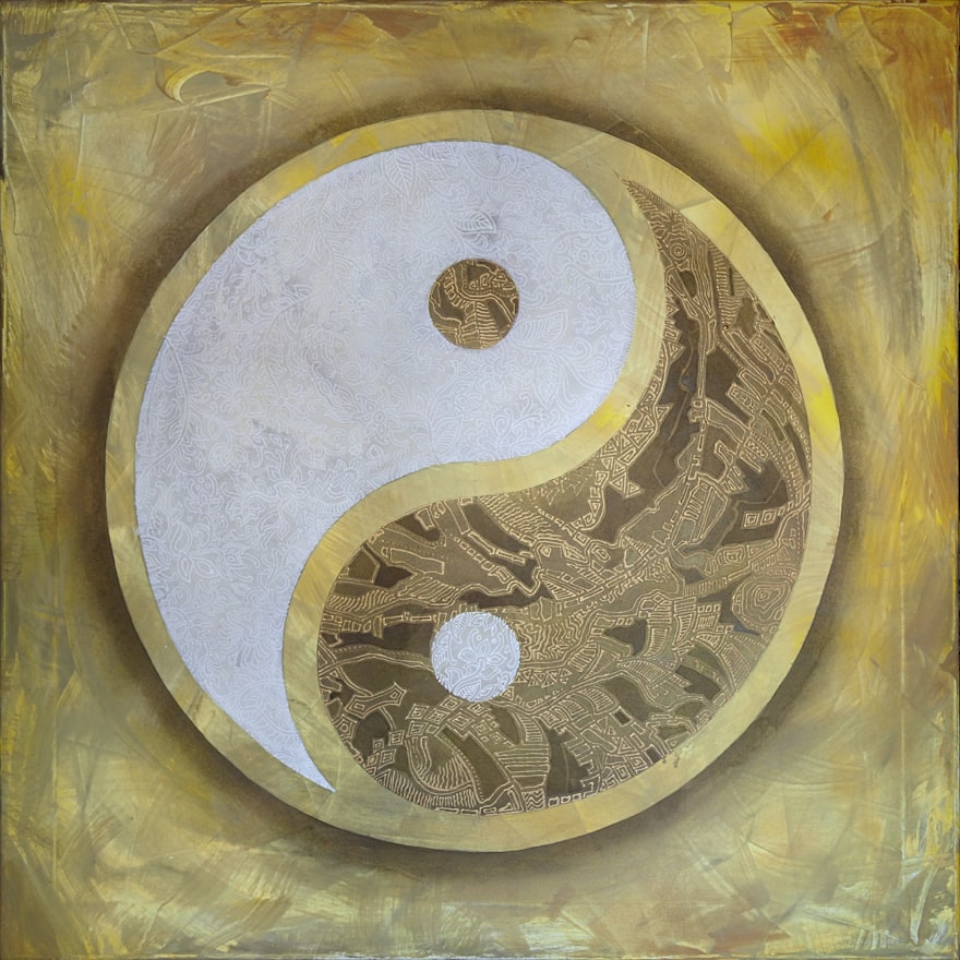 a gold and white symbol of yin yang
