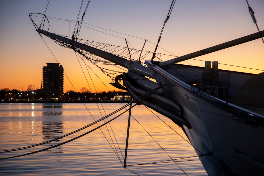 white sail boat on sea during daytime