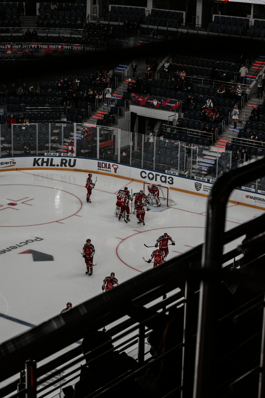 people playing ice hockey on ice stadium