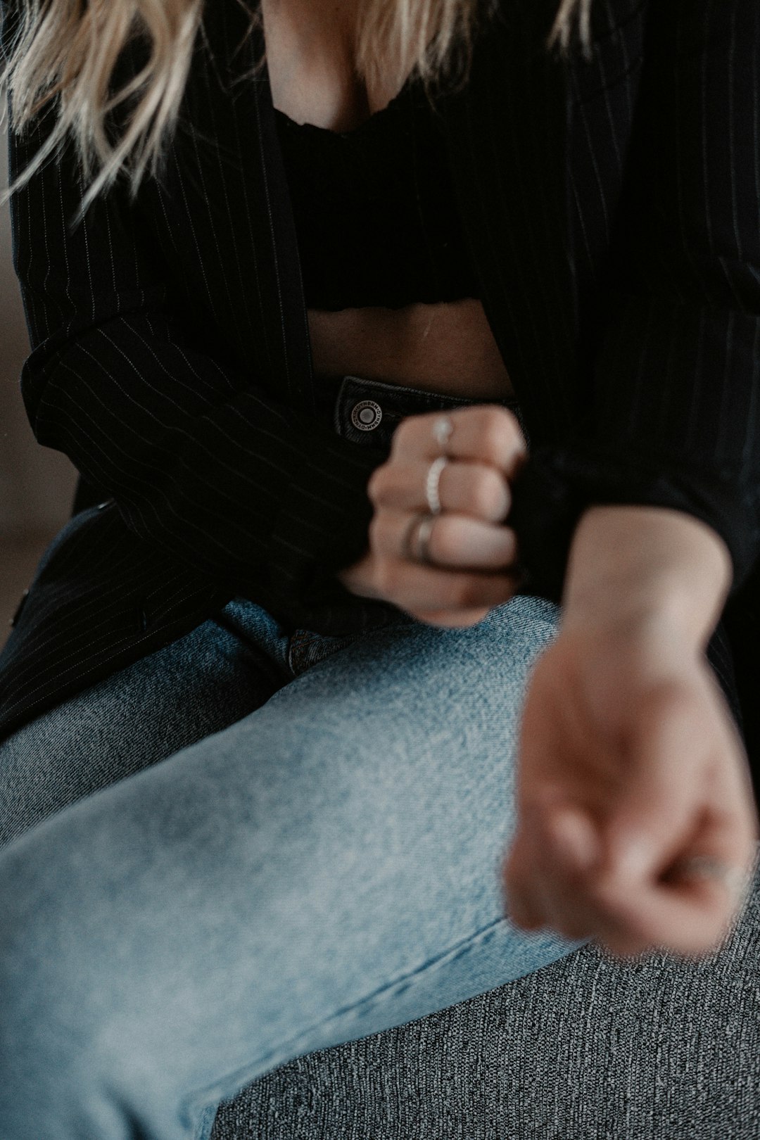 person in black and white pinstripe dress shirt