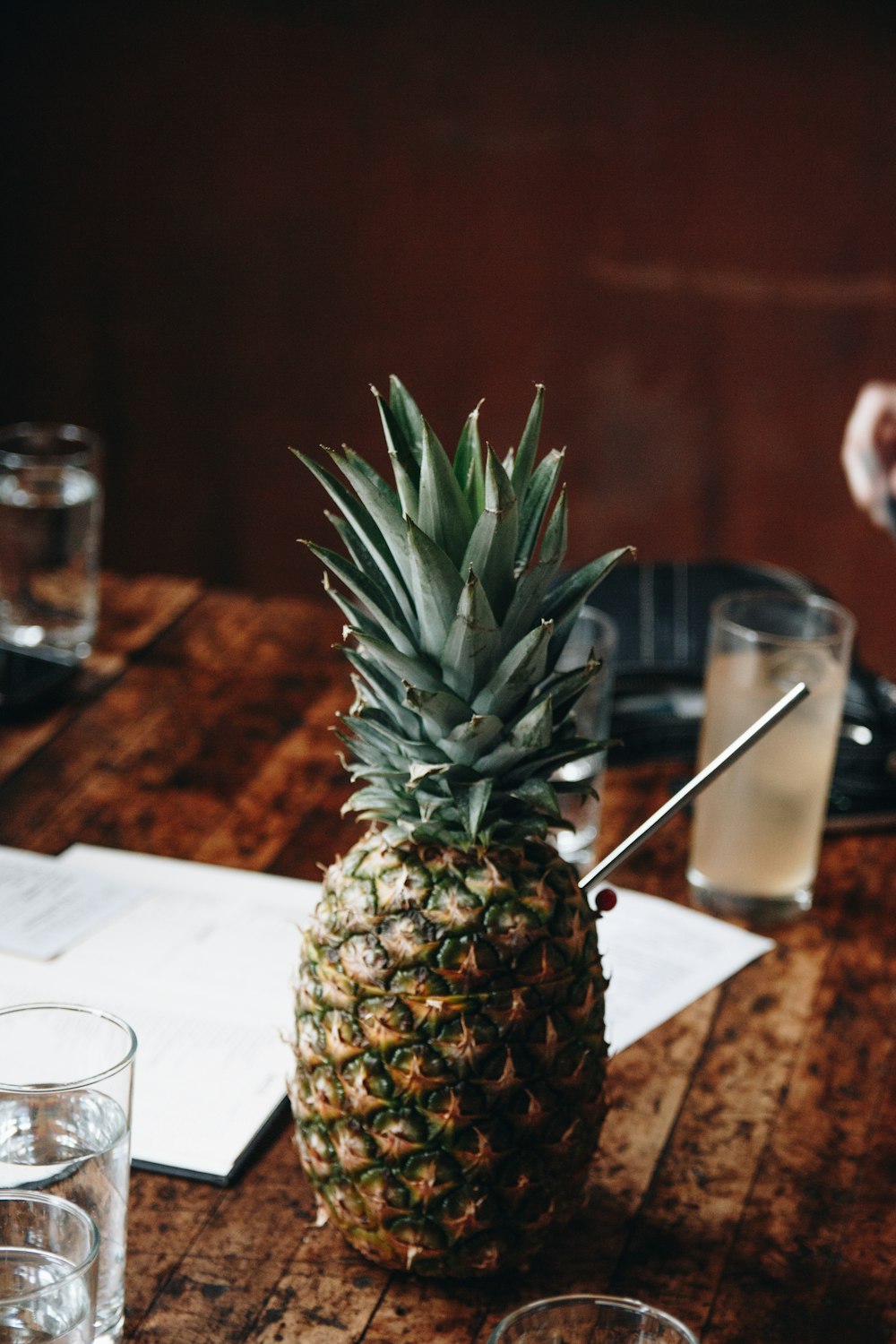 pineapple fruit on brown wooden table