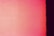 A gradient image with shades of red and pink fading from left to right, ending in a dark black stripe on the far right edge.