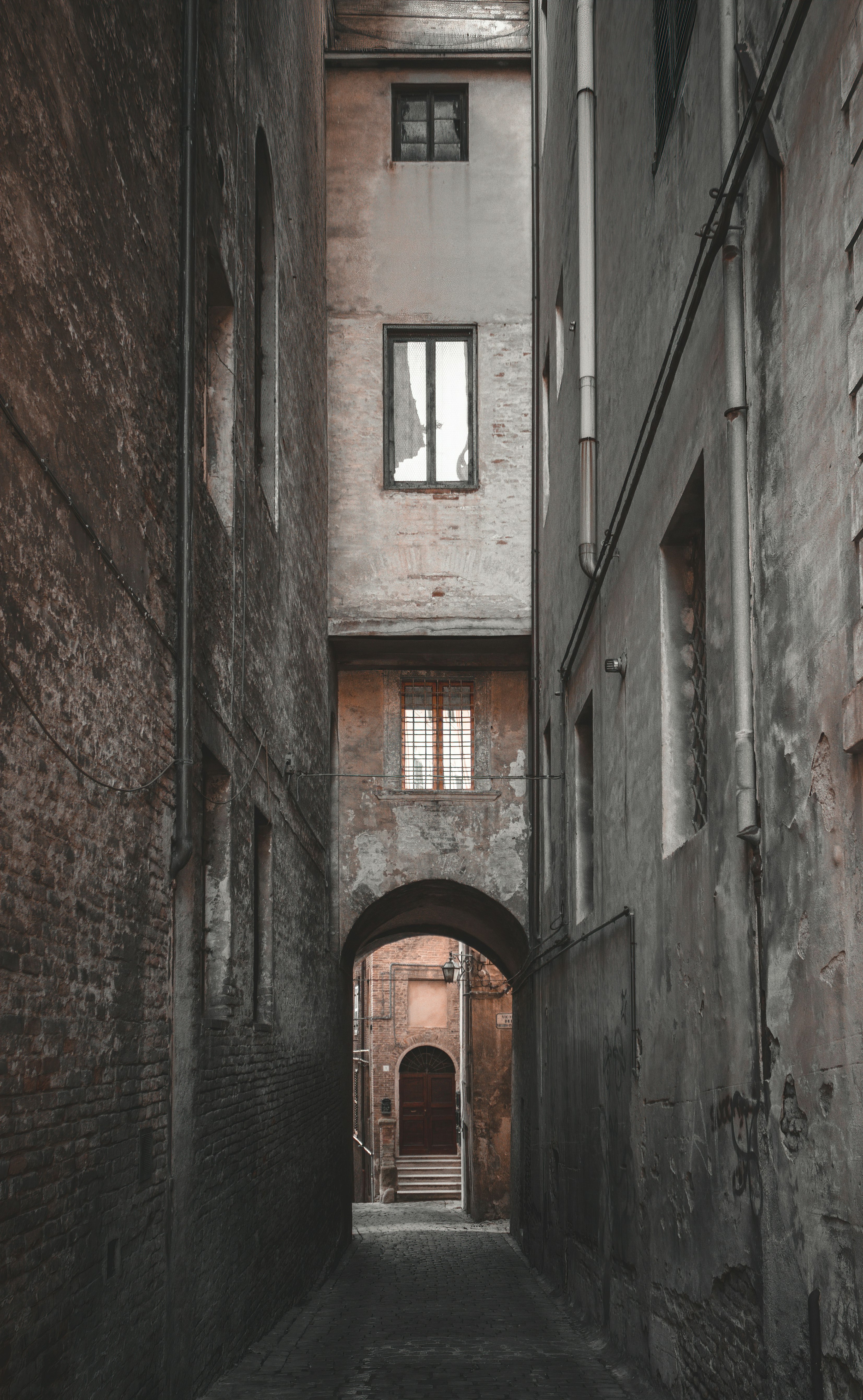 brown wooden door on gray concrete building