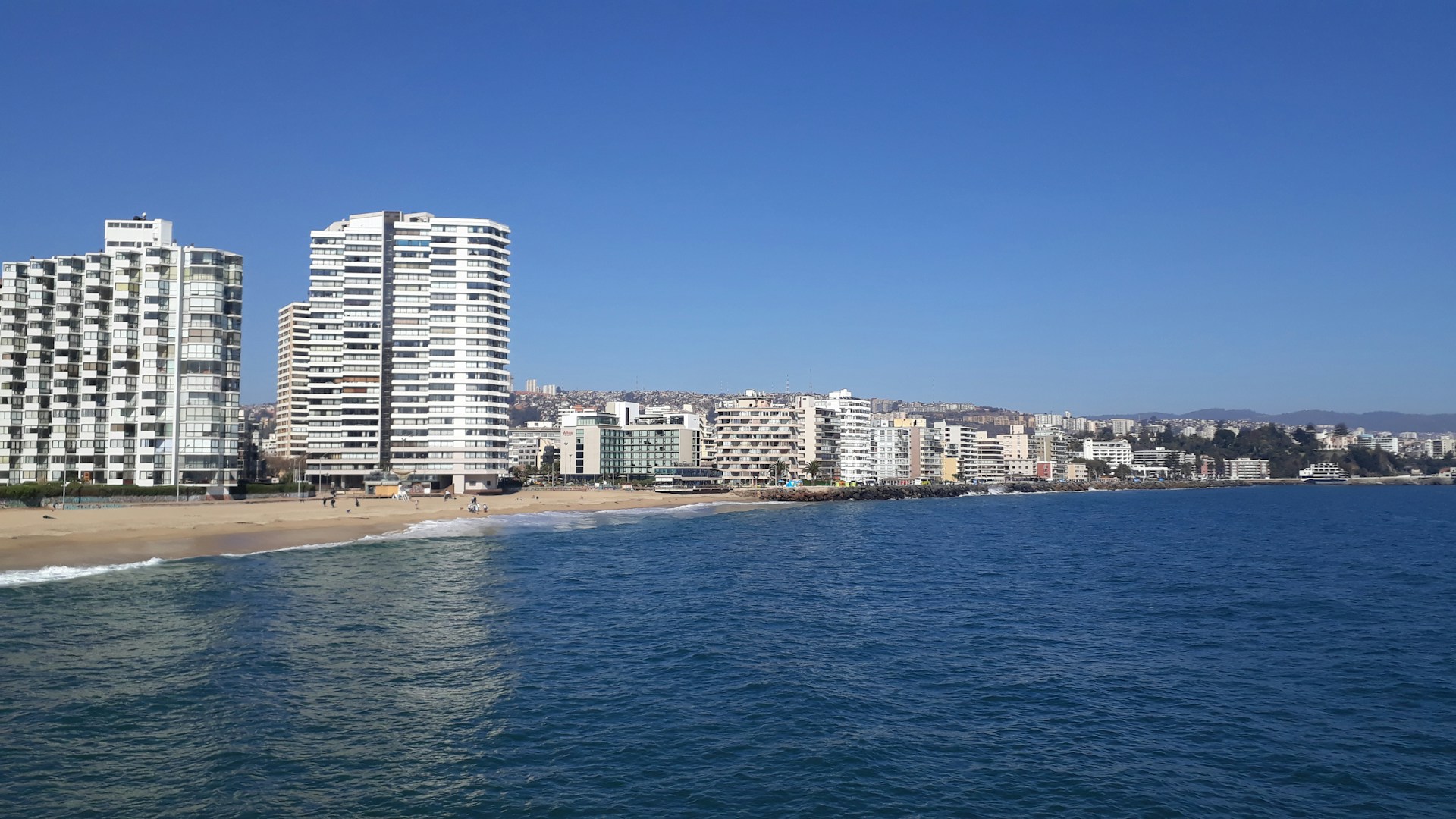 woman wearing yellow long-sleeved dress under white clouds and blue sky during daytime