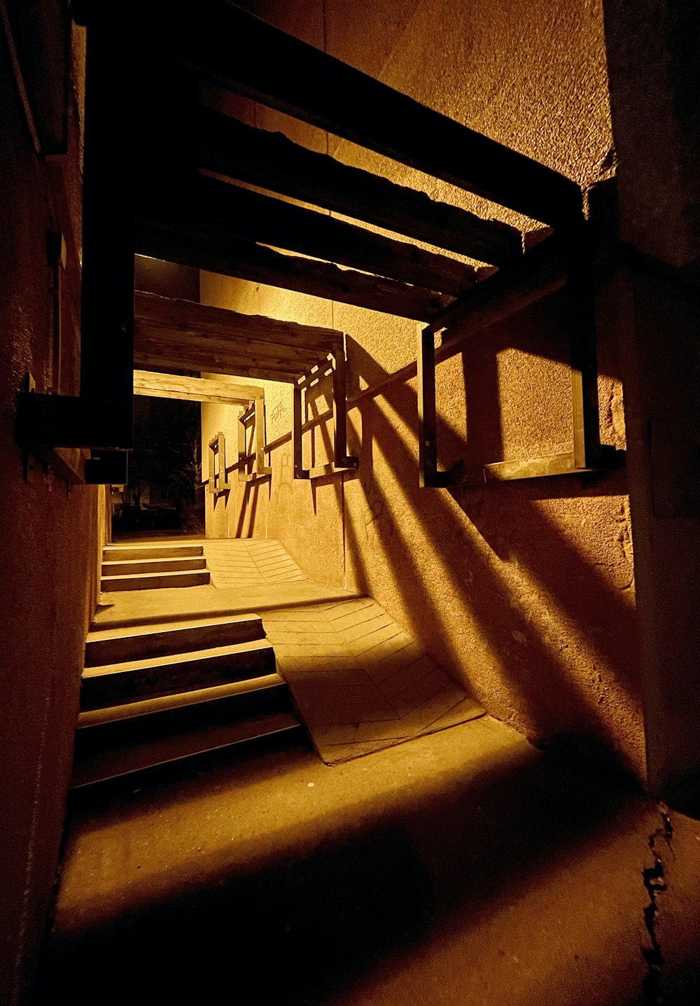 brown wooden staircase with brown wooden railings