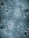 The image features a detailed close-up view of marble or stone tiles with intricate swirling patterns in shades of blue and gray. The tiles are arranged in a symmetrical pattern, creating a visually pleasing and consistent design.