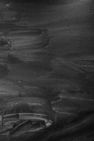 Custom 3D printed parts with industrial textures on a black metal surface