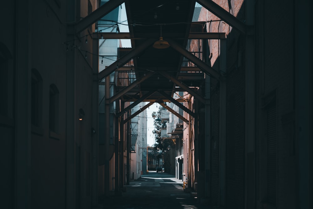 silhouette of person walking on hallway during daytime