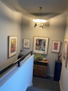 Entrance hallway decorated with local art and warm lighting.