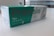 A box containing a COVID-19 antigen test kit, labeled 'Précisio Test', is placed on a white surface. The box is primarily green and white, with text in both English and Arabic. The image shows the product design and branding details.