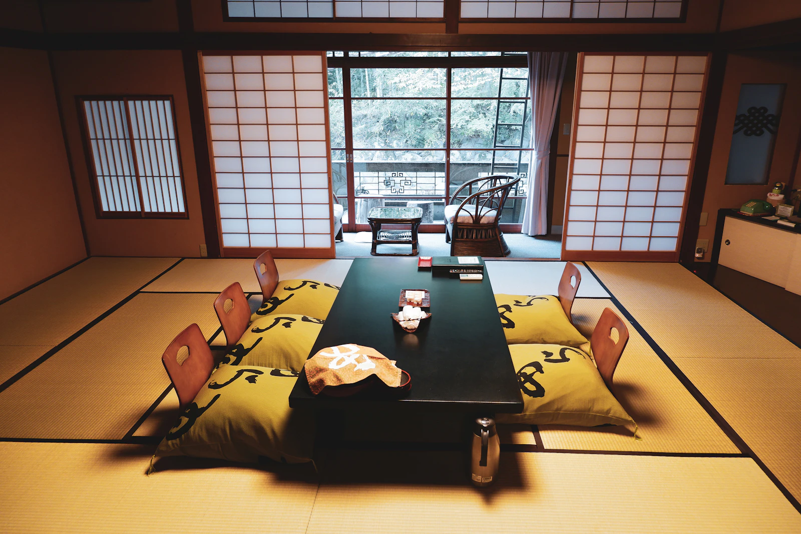 A tatami room with a low table and shoji screens