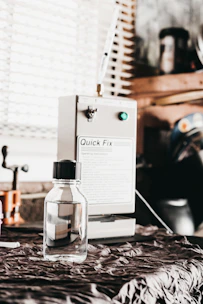 Bottles of anaerobic sealants arranged neatly on a workshop shelf
