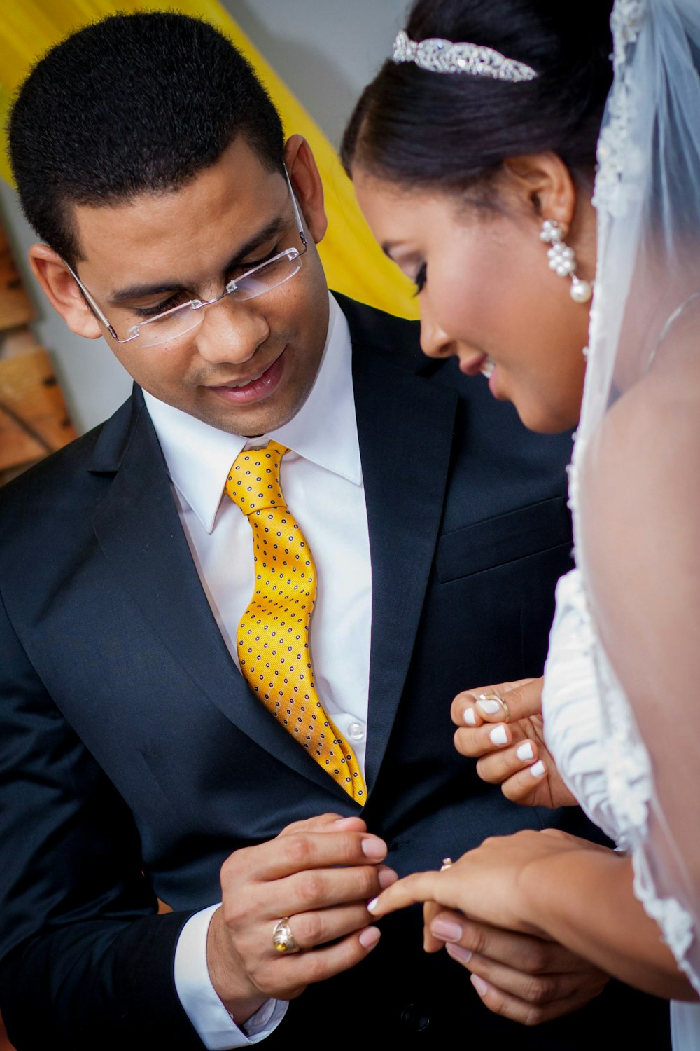 man in black suit jacket and yellow necktie