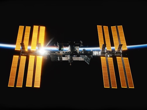 An image of astronauts working on a space station, emphasizing collaboration in space.