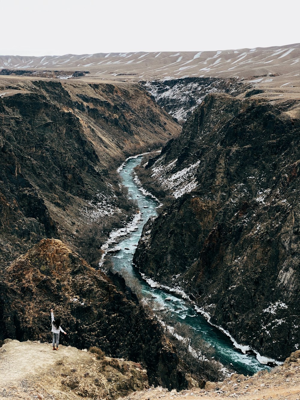 aerial view of river between mountains during daytime