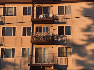 brown concrete building with window type ac unit