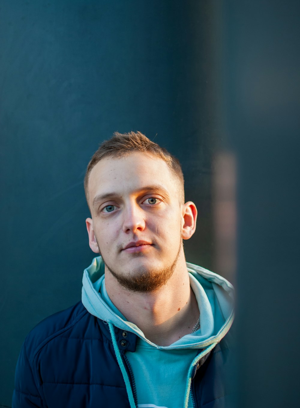 man in blue zip up jacket