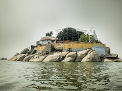 body of water near white concrete building during daytime