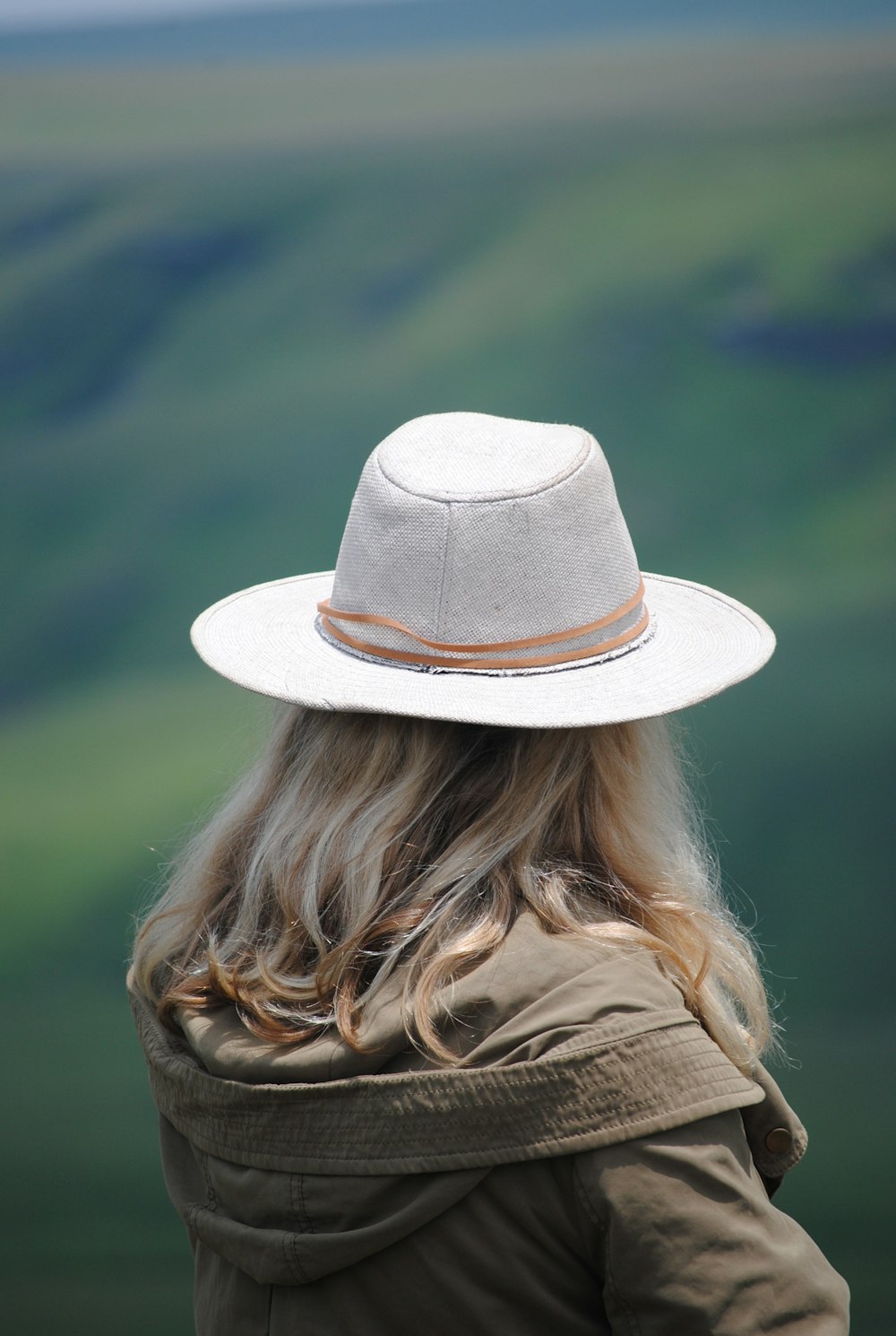 woman in brown hat and brown jacket