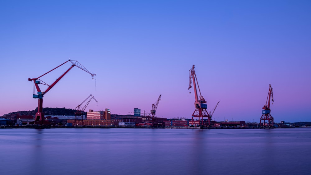 crane near body of water during daytime