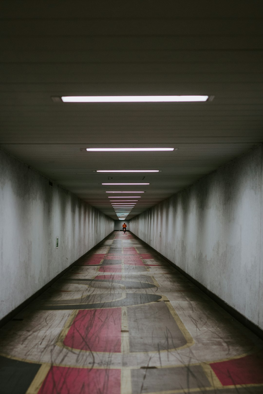 gray concrete tunnel with light