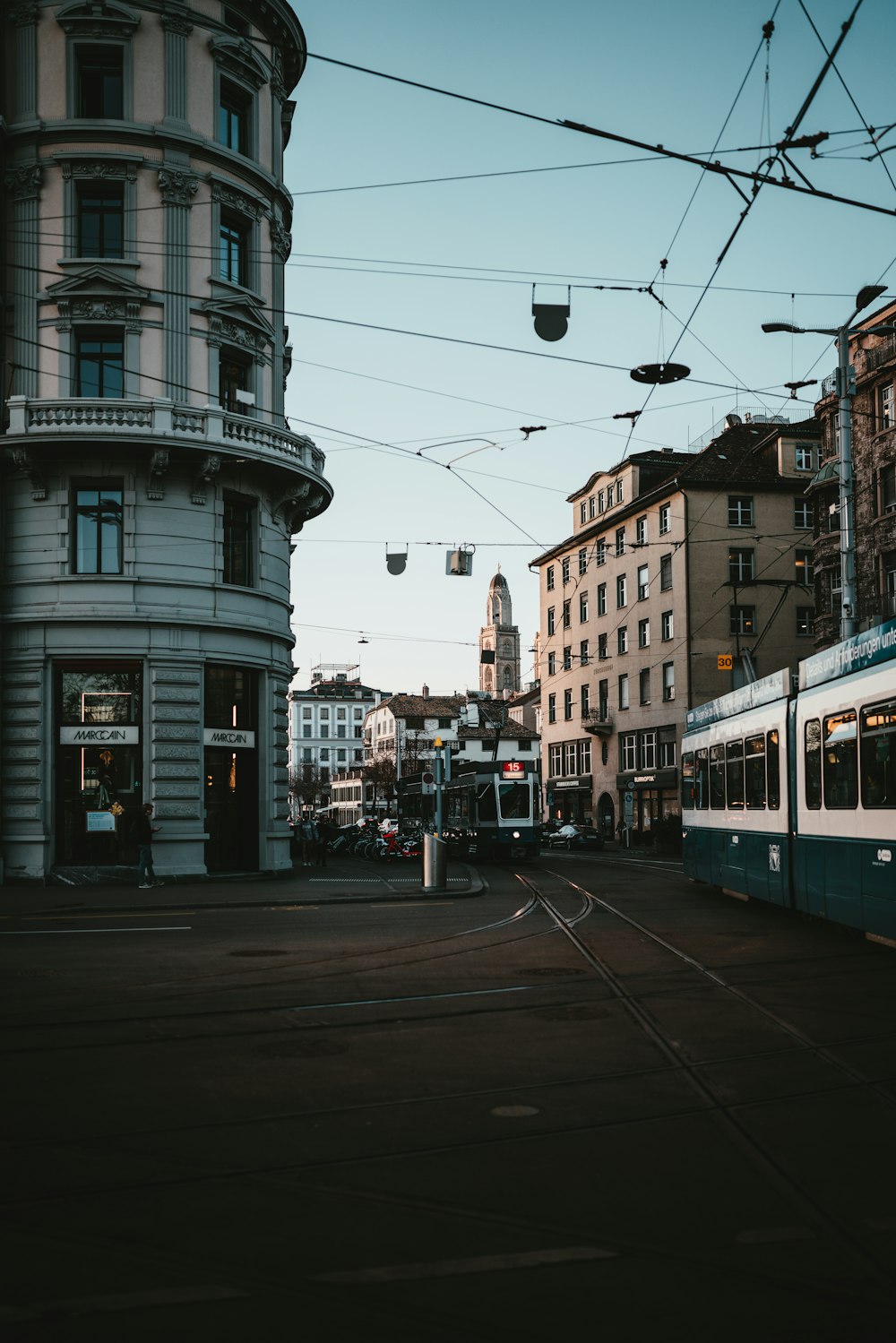 white and blue train on the street