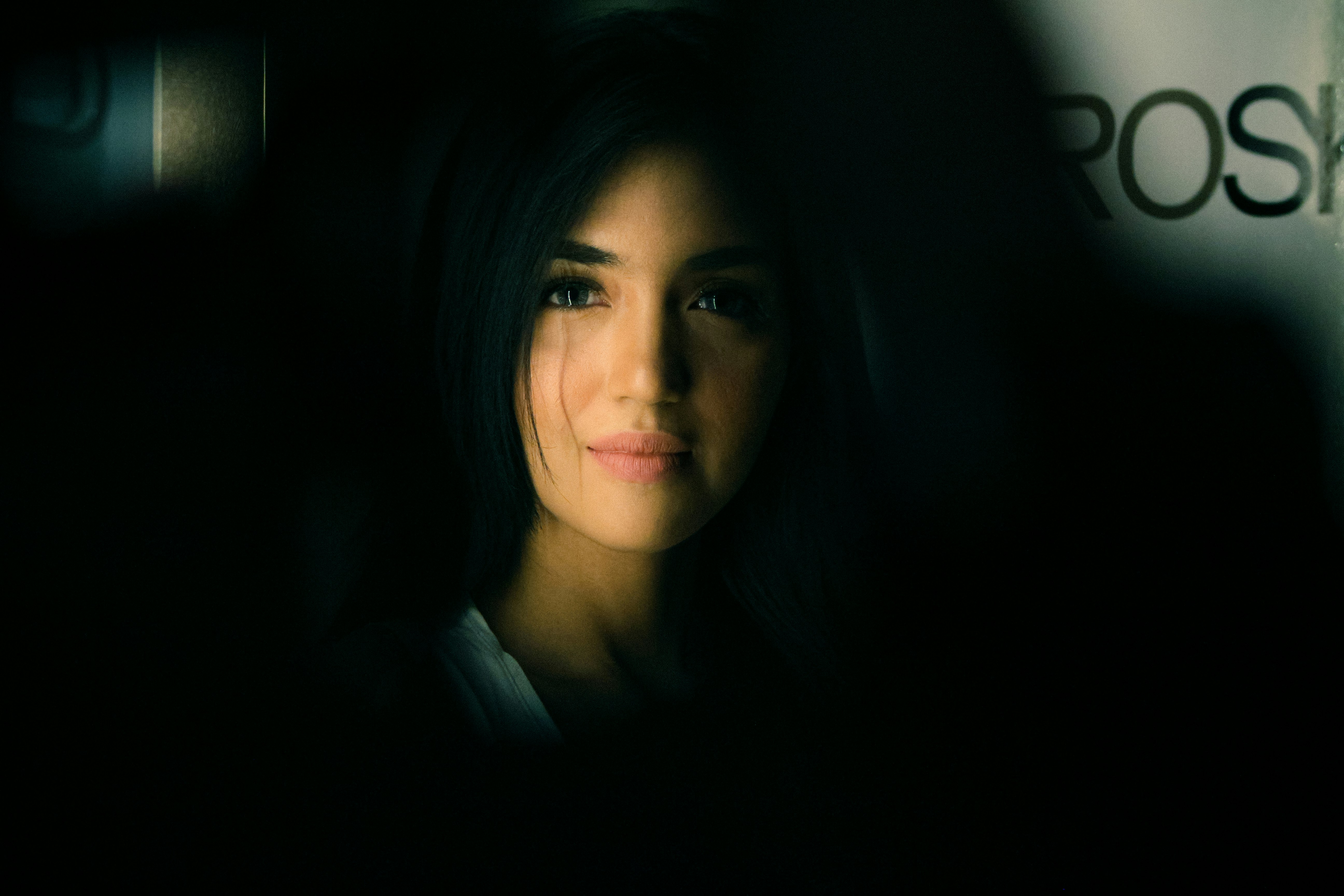 woman in black shirt smiling