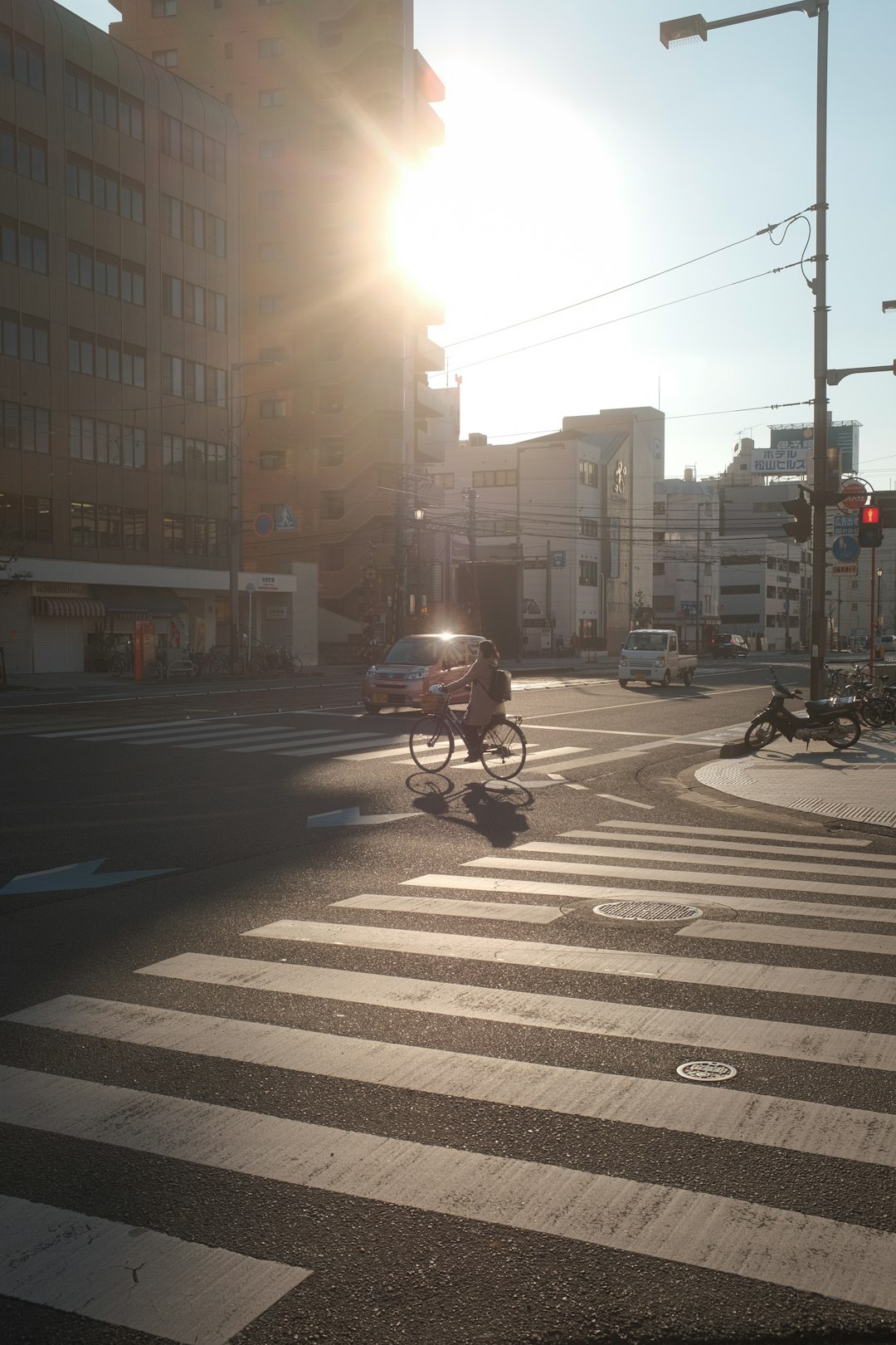 man in black jacket riding motorcycle on pedestrian lane during daytime