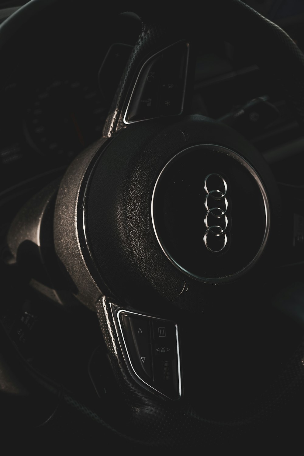 black and silver audi steering wheel