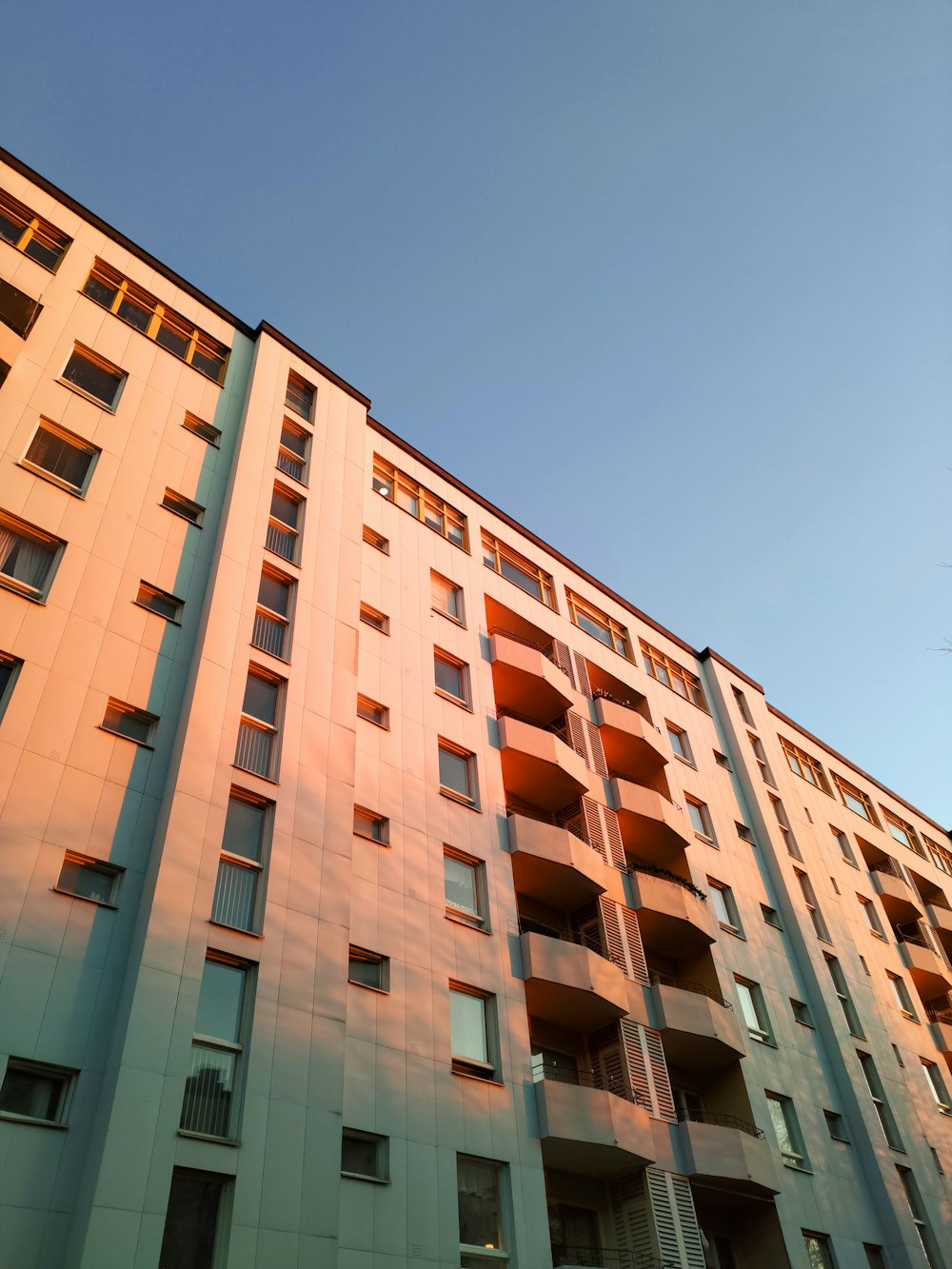 brown concrete building under blue sky during daytime