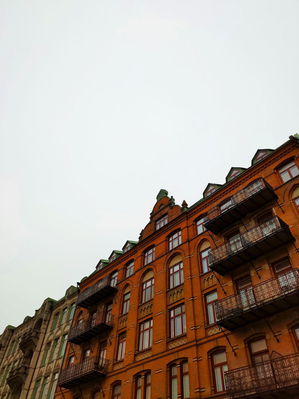 brown concrete building under white sky during daytime