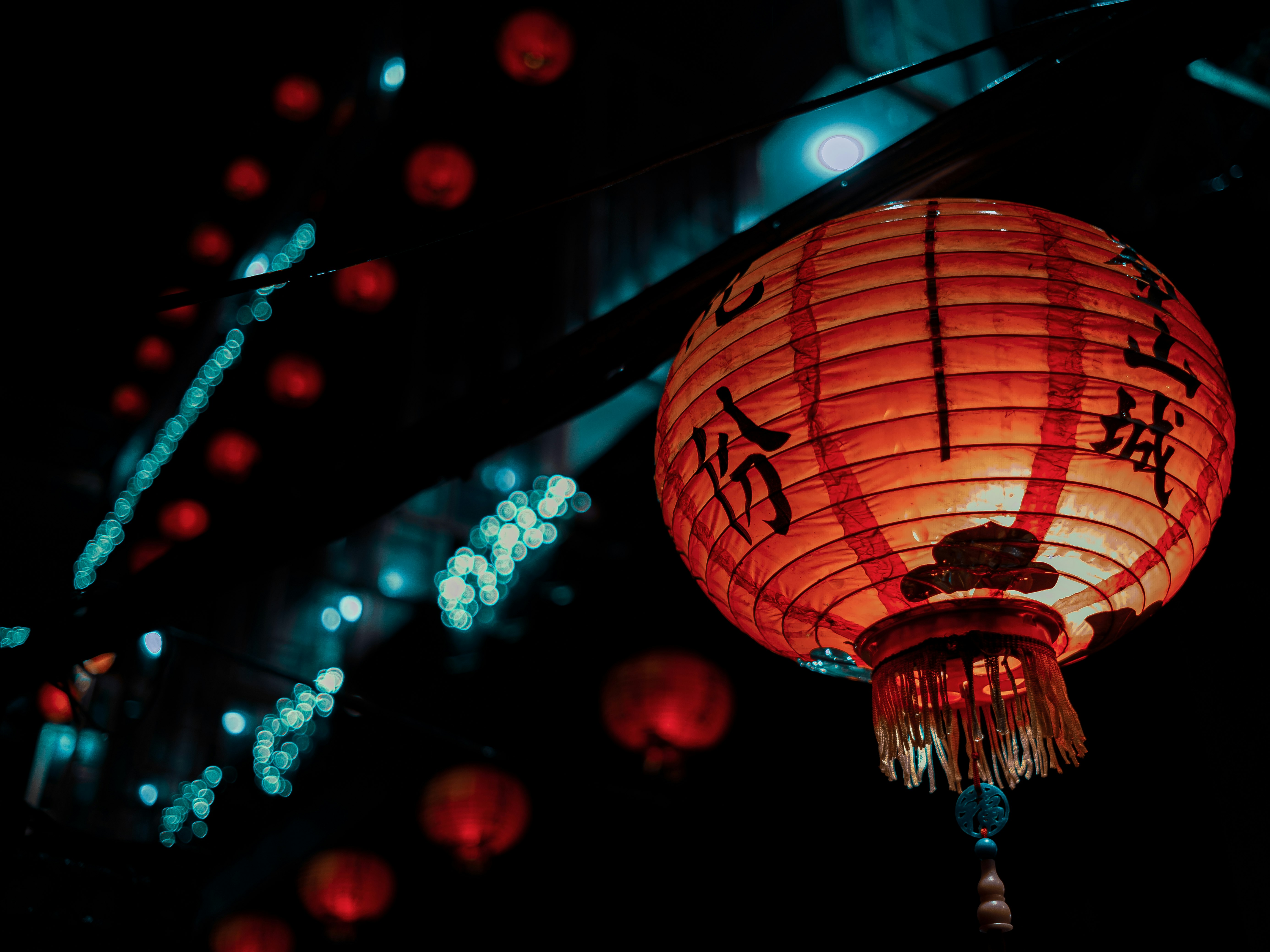 red paper lantern with bokeh lights