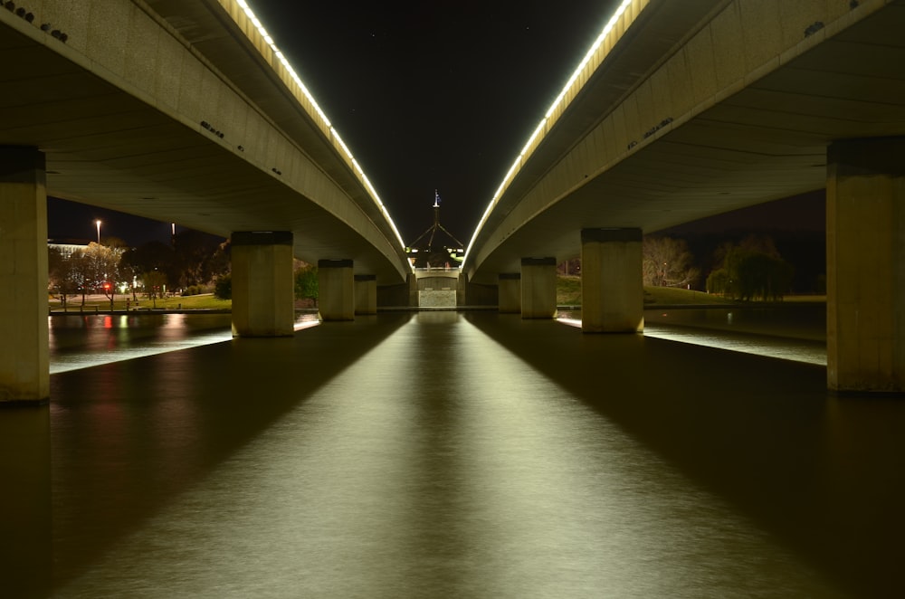 gray concrete bridge over river during daytime