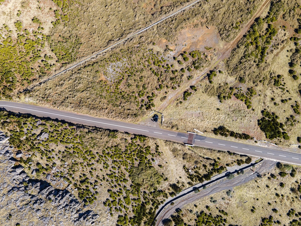 an aerial view of a road in the middle of nowhere