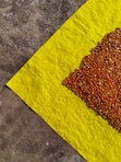 brown powder on yellow textile