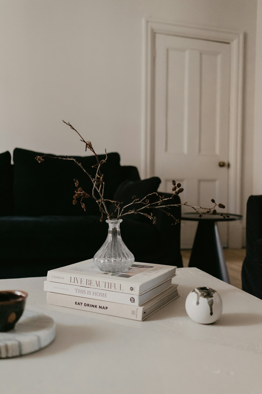 clear glass vase on white wooden table