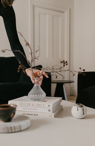 white ceramic vase on white wooden table