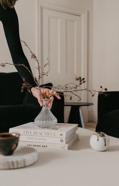 white ceramic vase on white wooden table