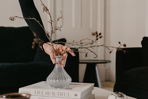 white ceramic vase on white wooden table