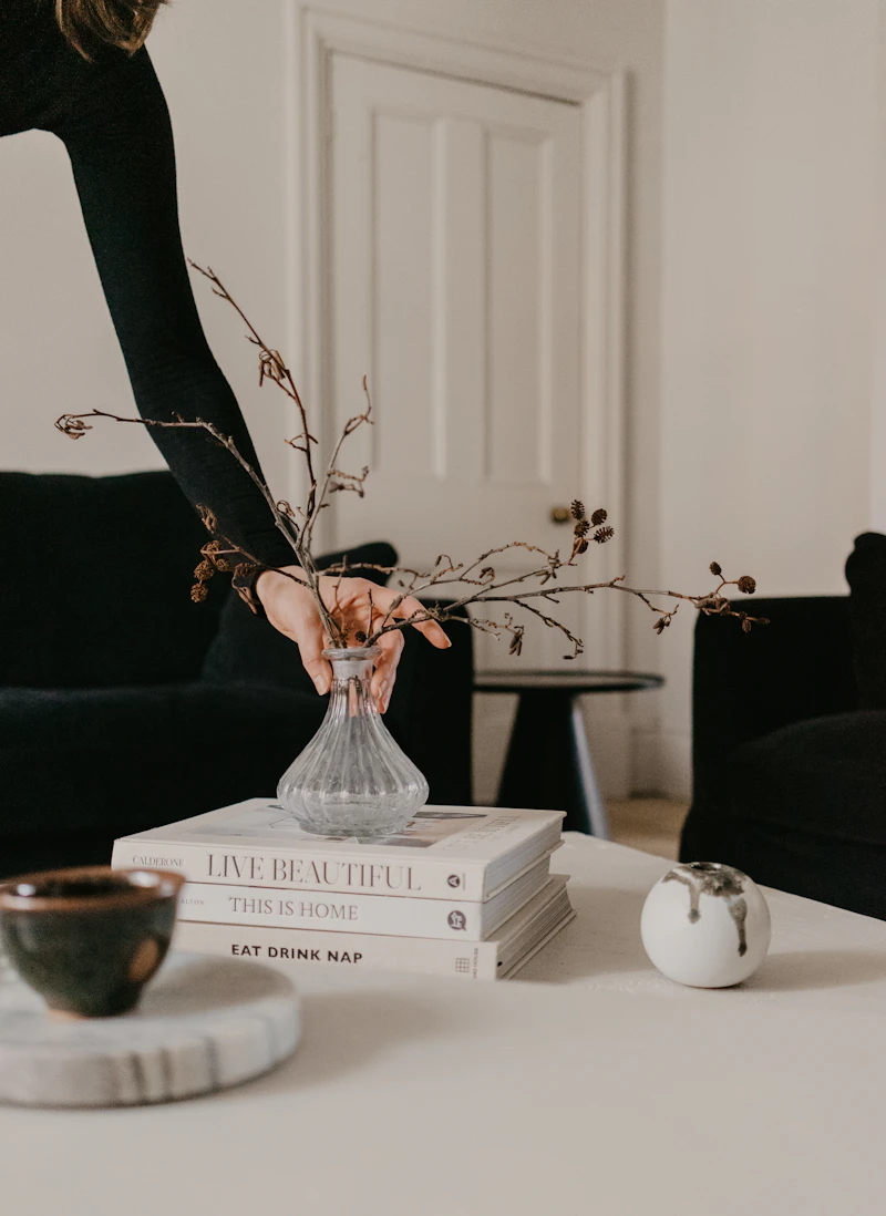 White ceramic vase on a white wooden table