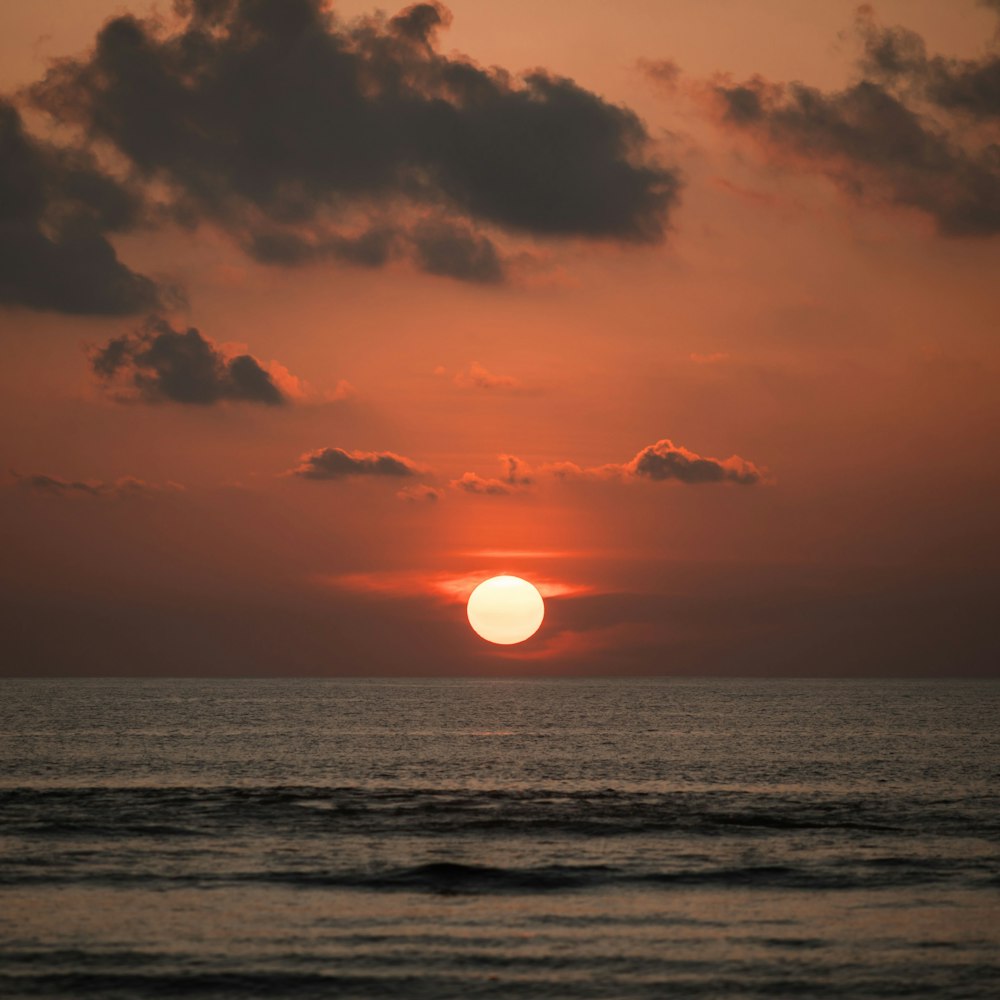 body of water during sunset