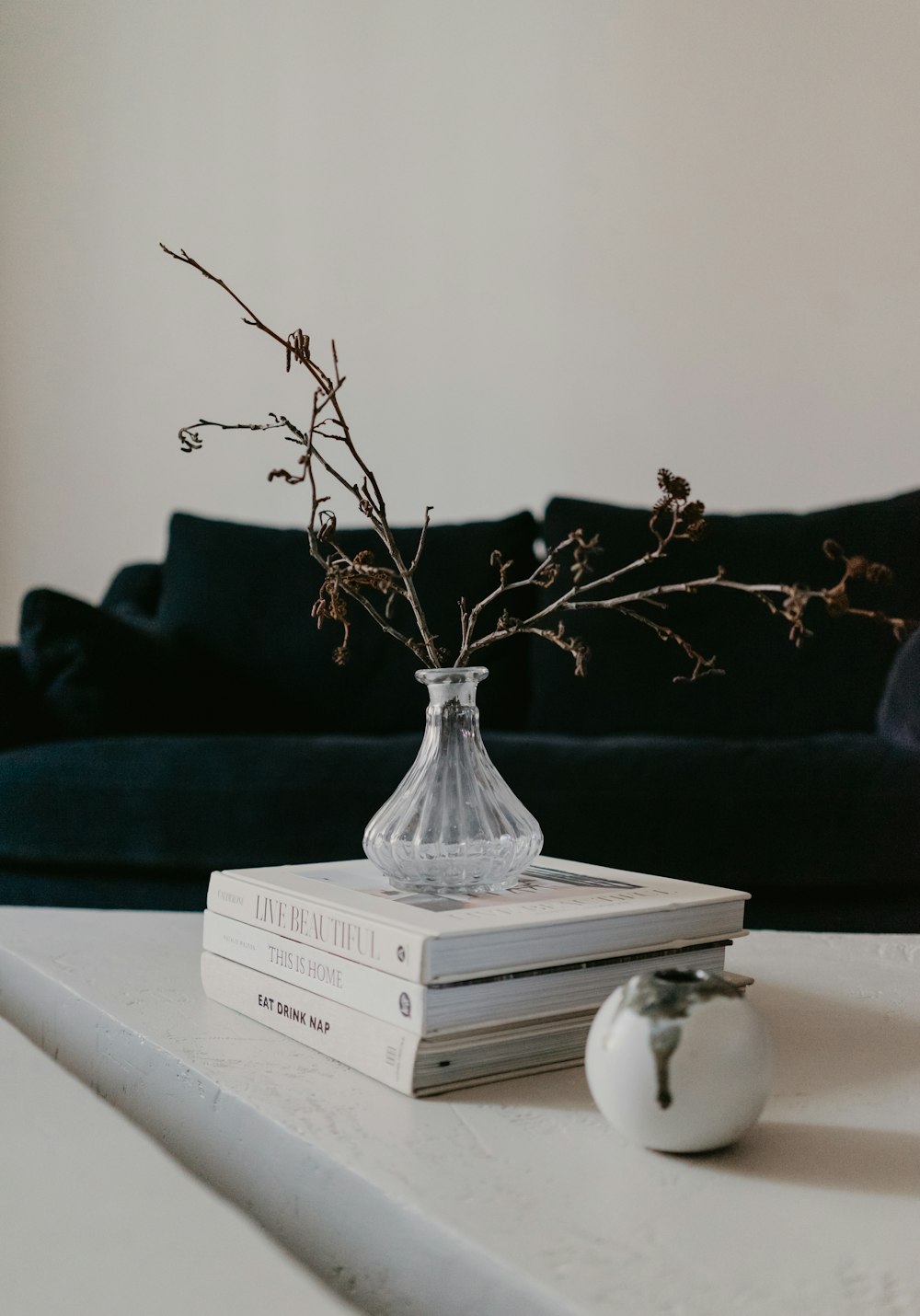 white book on white wooden table