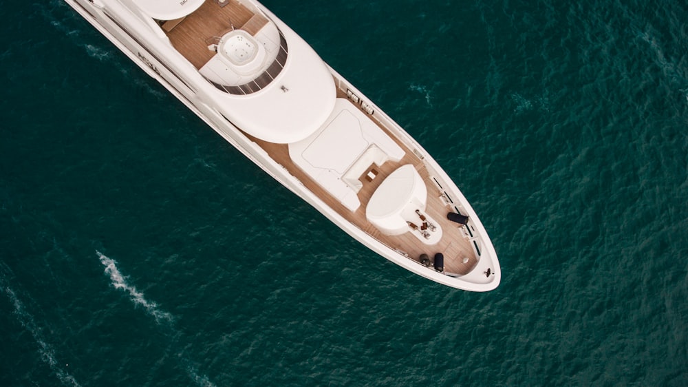 white and black boat on blue sea during daytime